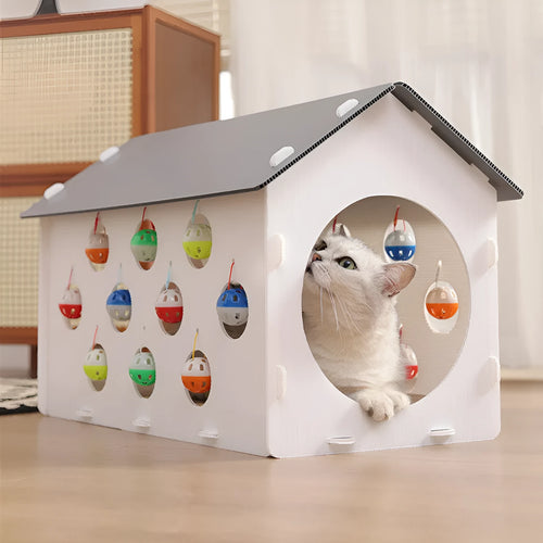 Plastic cat scratch board toy with integrated raised cat nest, tunnel, and bell ball.