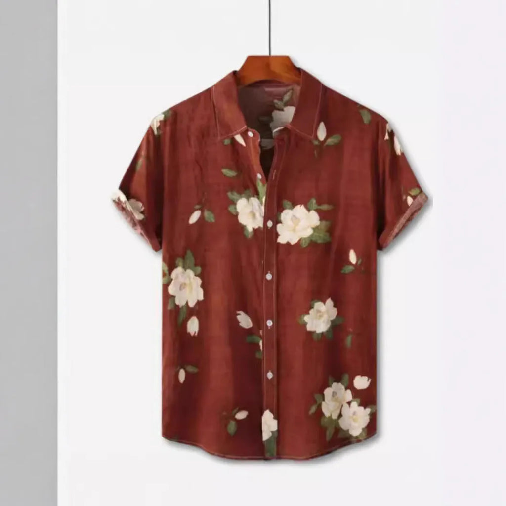 Man wearing a short sleeve Hawaiian print shirt with a floral lapel, made from elastic polyester fabric.