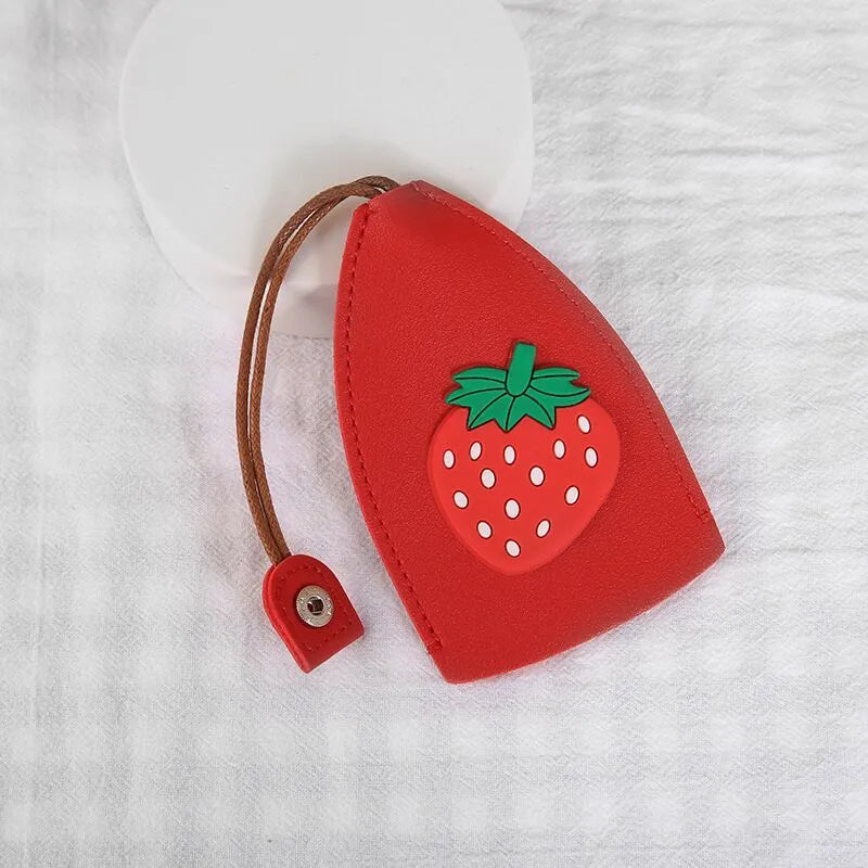 Cartoon pull-out key case in PU leather showing design options including resin fruit and big cartoon animal prints.