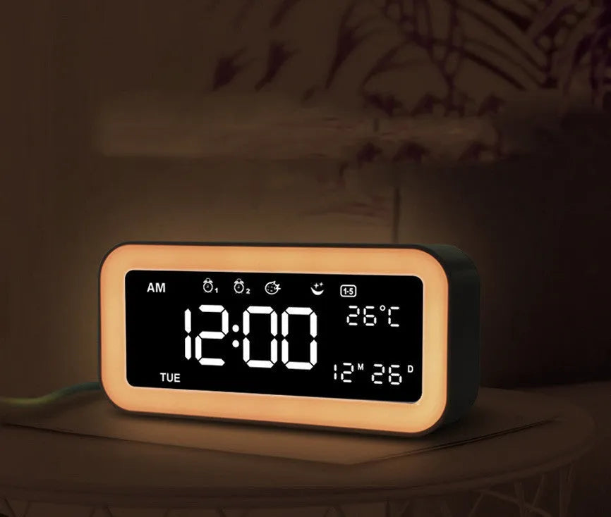 Blue rectangular LED atmosphere light alarm clock with digital display on quartz glass.