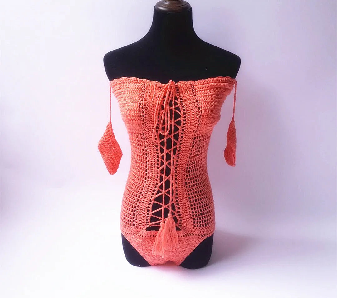 Women's off-shoulder one-piece swimsuit on a mannequin, shown in a light colour.