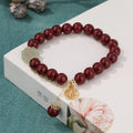 Retro national style cinnabar bracelet with purple gold sand, fu character and peach blossom motifs