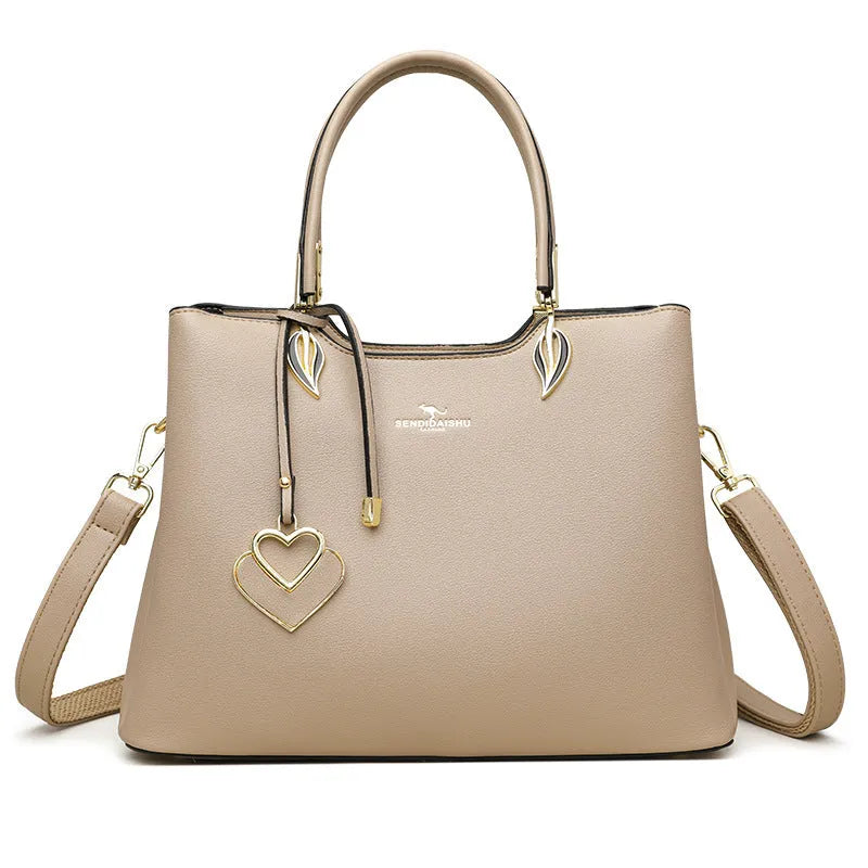 Women's black PU leather shoulder messenger bag with multi-layer compartments and visible stitching details
