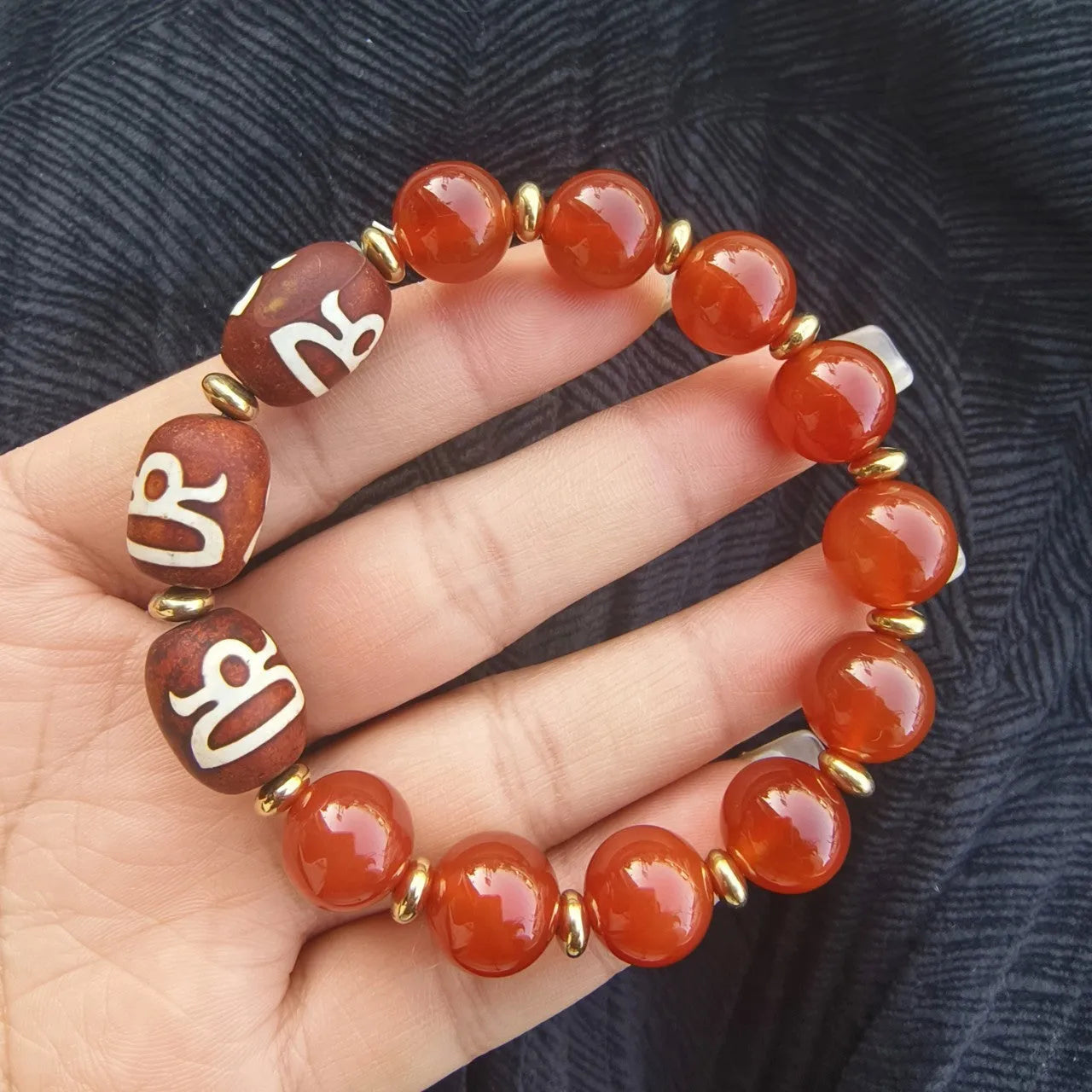 Agate Tibetan dzi bead bracelet with three-eye design and polished finish