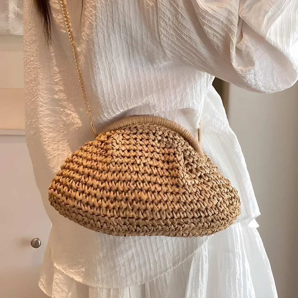 Women's straw beach shoulder bag in khaki colour with chain detailing and shell shape
