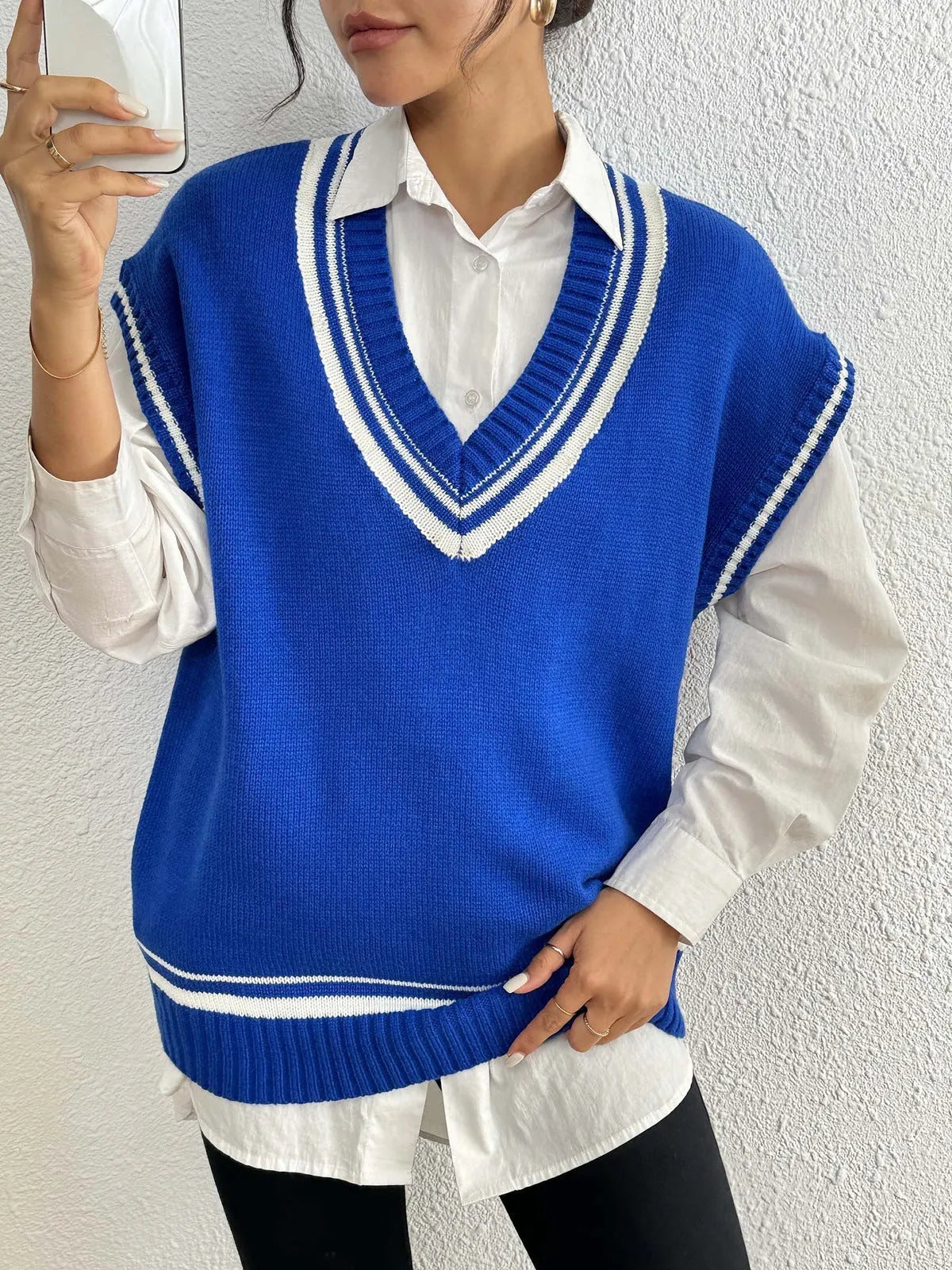 Women's college style casual vest sweater in loose fit with acrylic polyester blend fabric