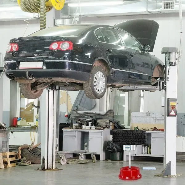 Portable aluminium hub balancer with enamel base for wheel balancing.