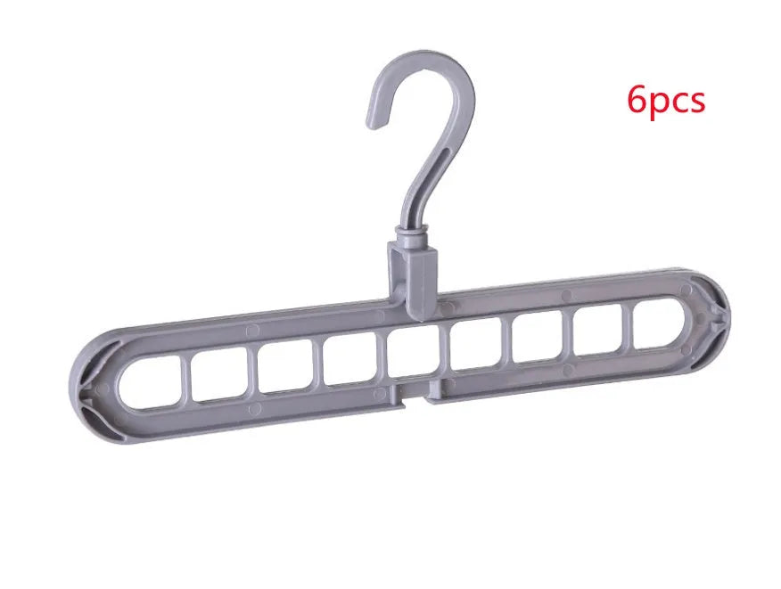 Plastic clothes hanger with rotating hook in assorted colours on white background