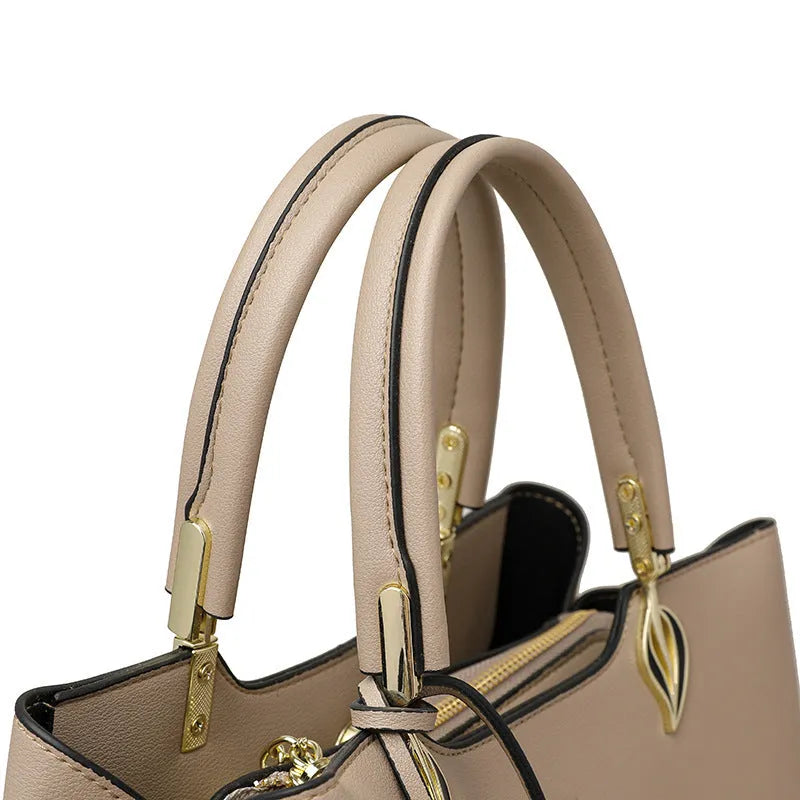 Women's black PU leather shoulder messenger bag with multi-layer compartments and visible stitching details