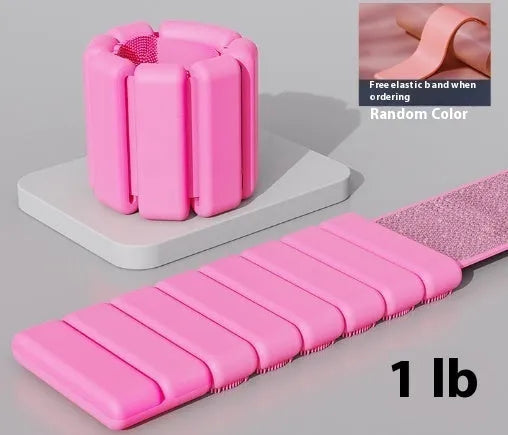 Adjustable silicone fitness bracelet with detachable 1lb or 2lb weight options in pink, black, grey and blue.