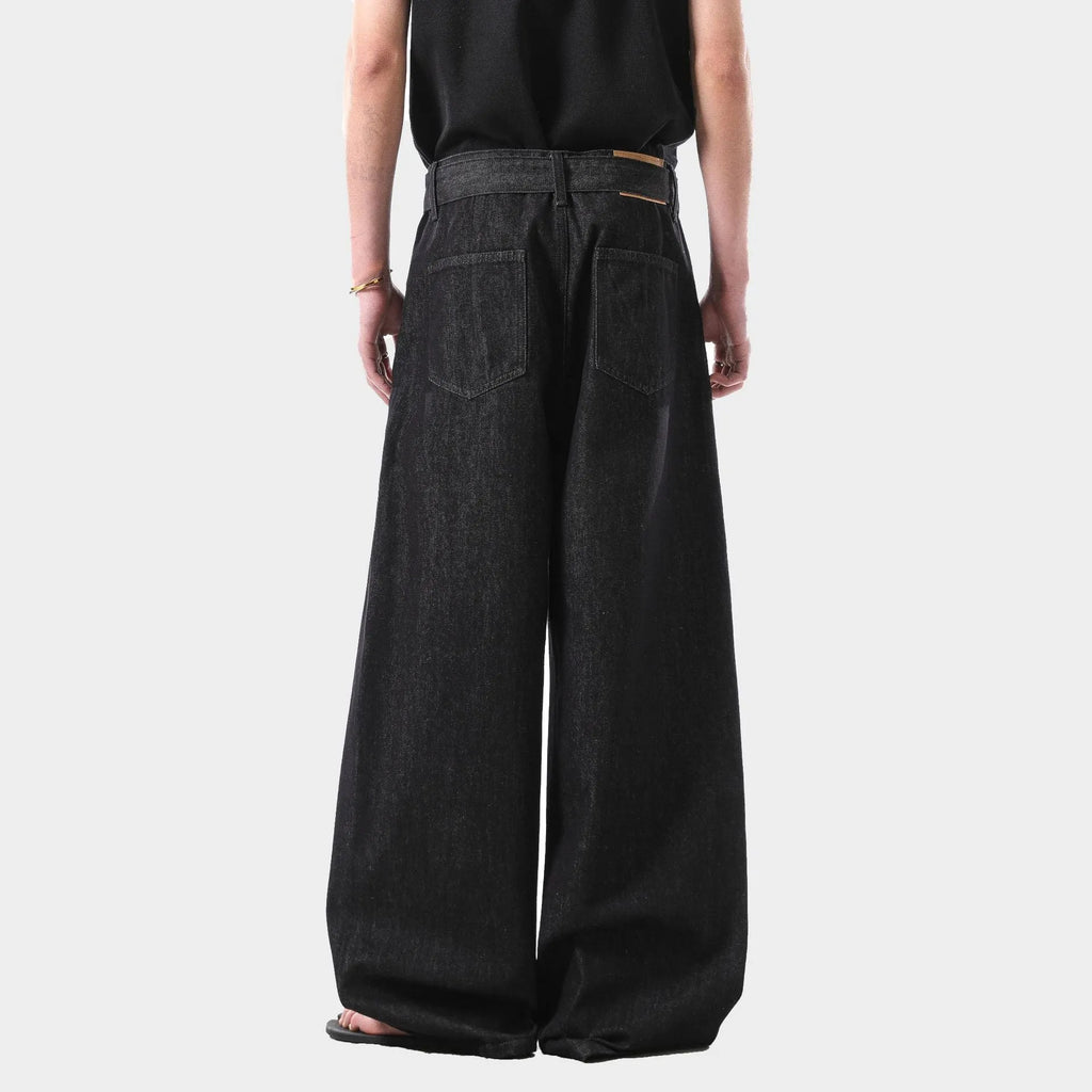 Women's high-waist straight-leg jeans in a black gold wash denim, showing front zip and five-pocket design.