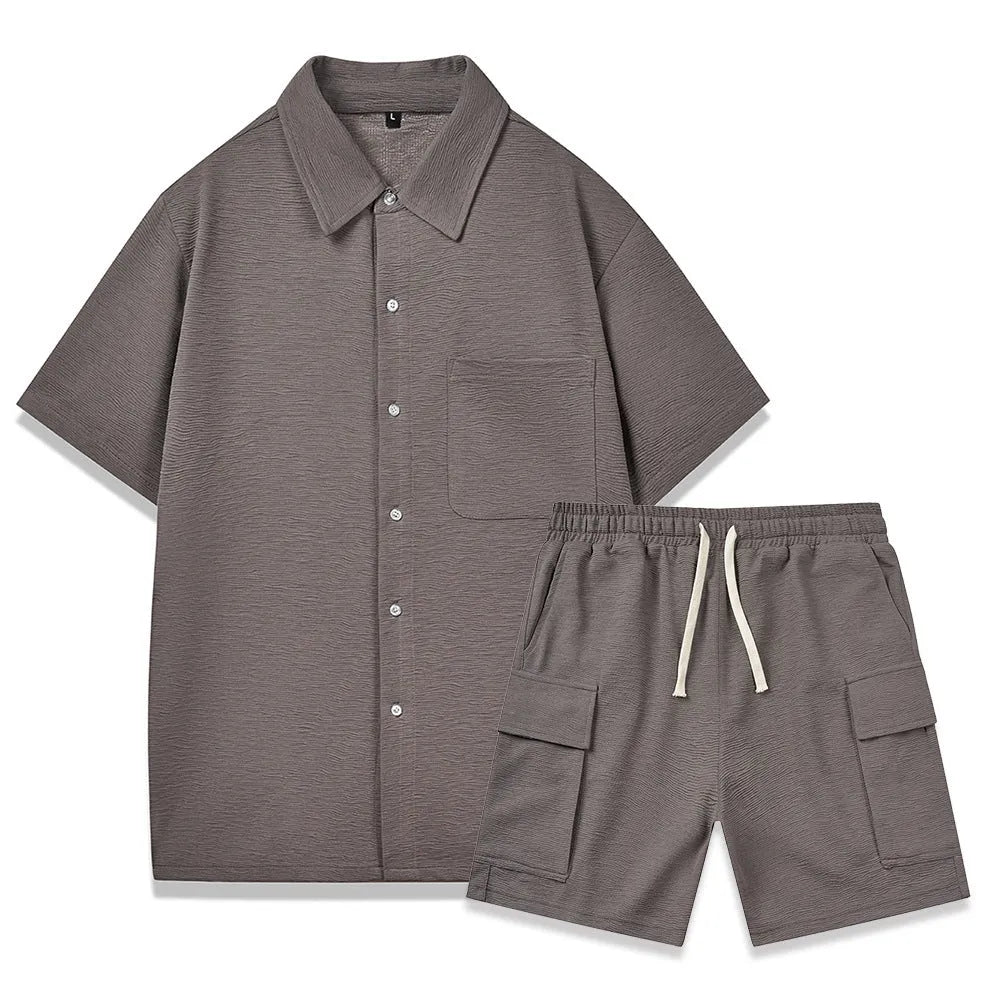 Women's beige polyester two-piece set with short sleeve top and elastic waist shorts laid flat.