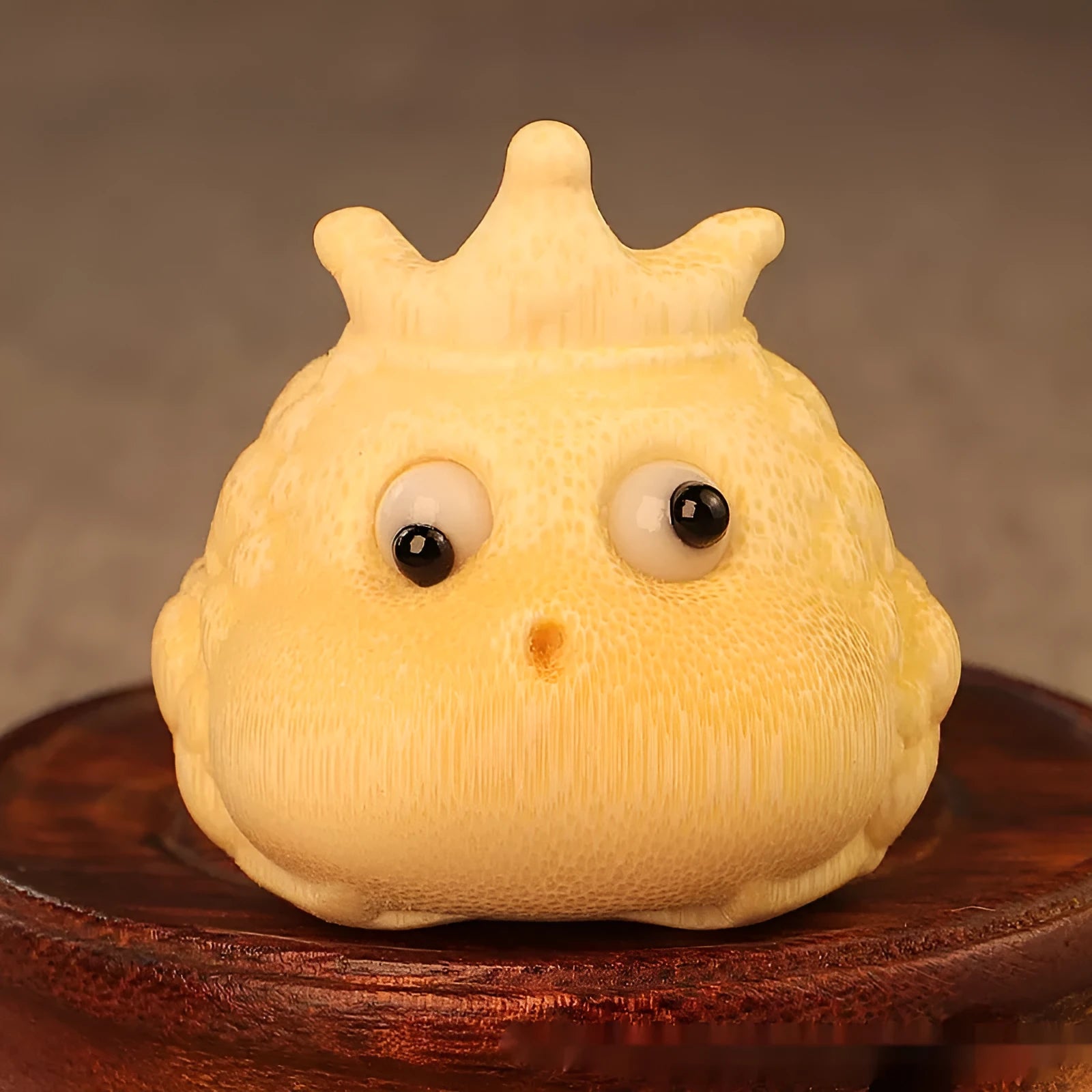 Solid bamboo carving of a Crown Princess toad ornament in cute style