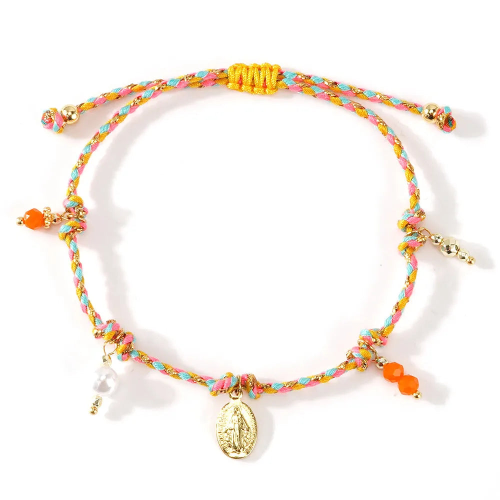 Close-up of a hand-woven colourful braided rope bracelet for women with a carrying strap tag.
