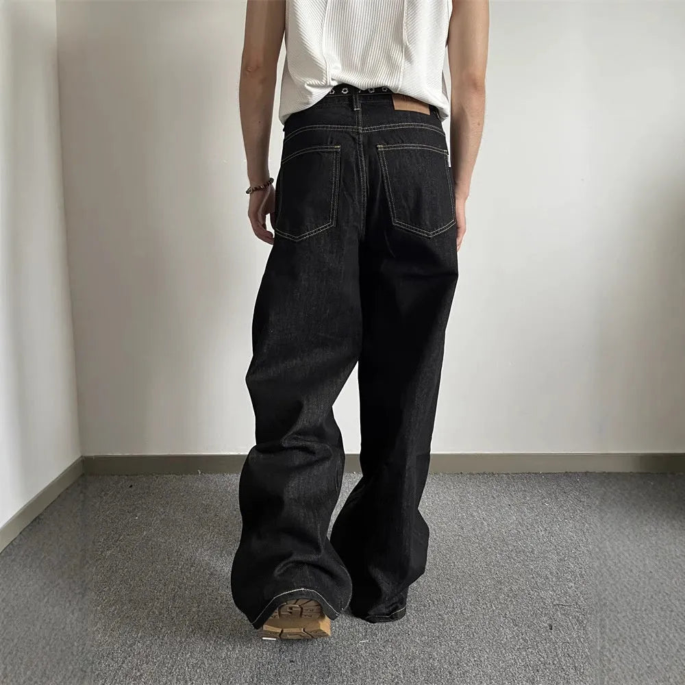 Black retro straight-leg jeans with wide-leg cut and mid-waist zip fly