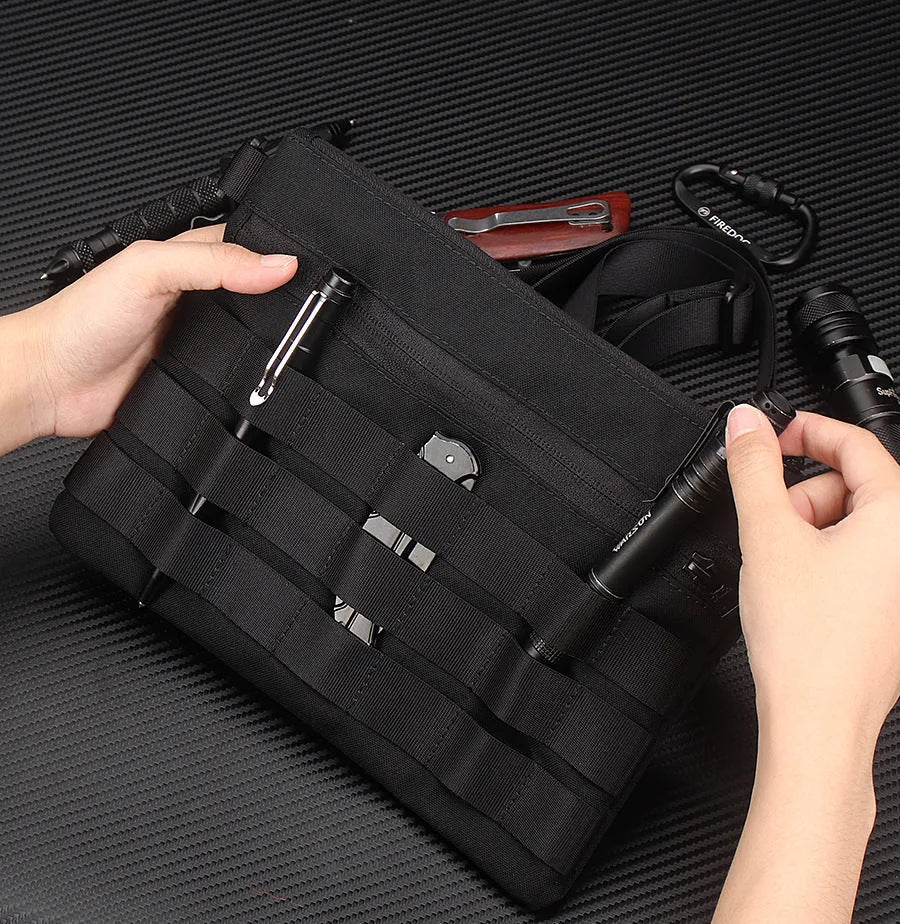 Black Oxford cloth military utility bag measuring 18 by 3.5 centimetres