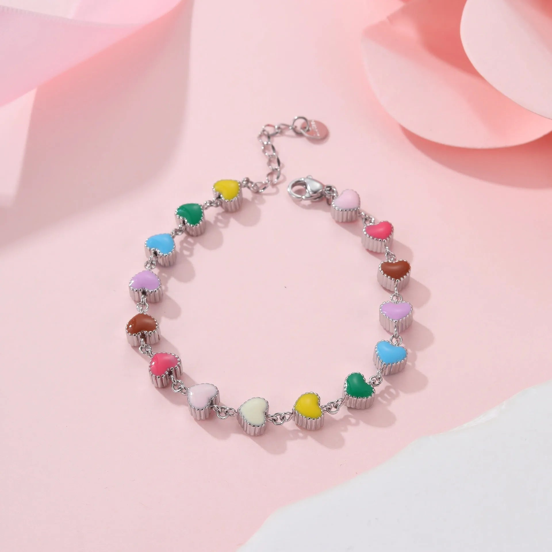 Women's adjustable heart pendant bracelet with colourful oil accents in gold or steel finish