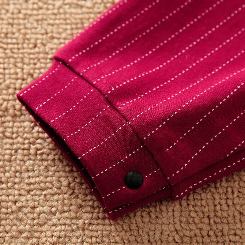 Wine red cotton baby boy romper with long sleeves and single-breasted closure for autumn.