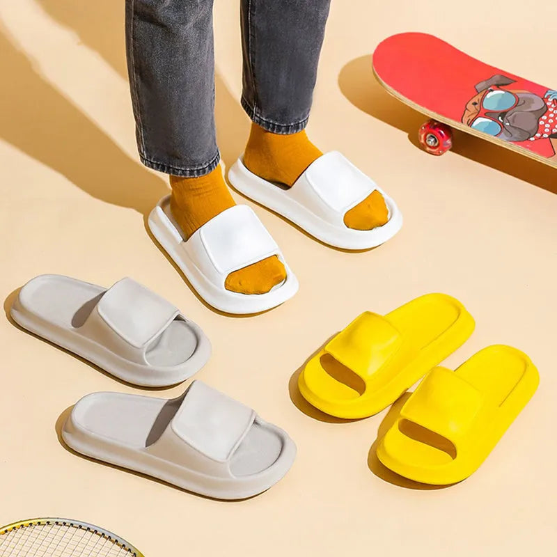 Pair of thick-soled EVA flip flop slippers in purple, showing deep sole profile.