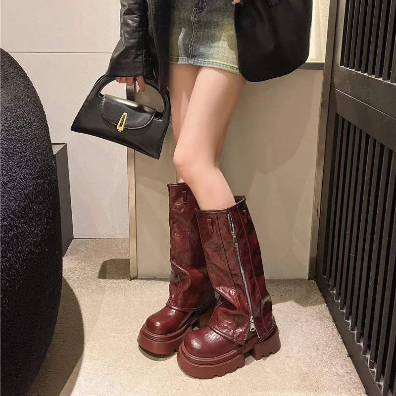Women's black platform Martin boots with square heels and high cylinder socks on wooden floor
