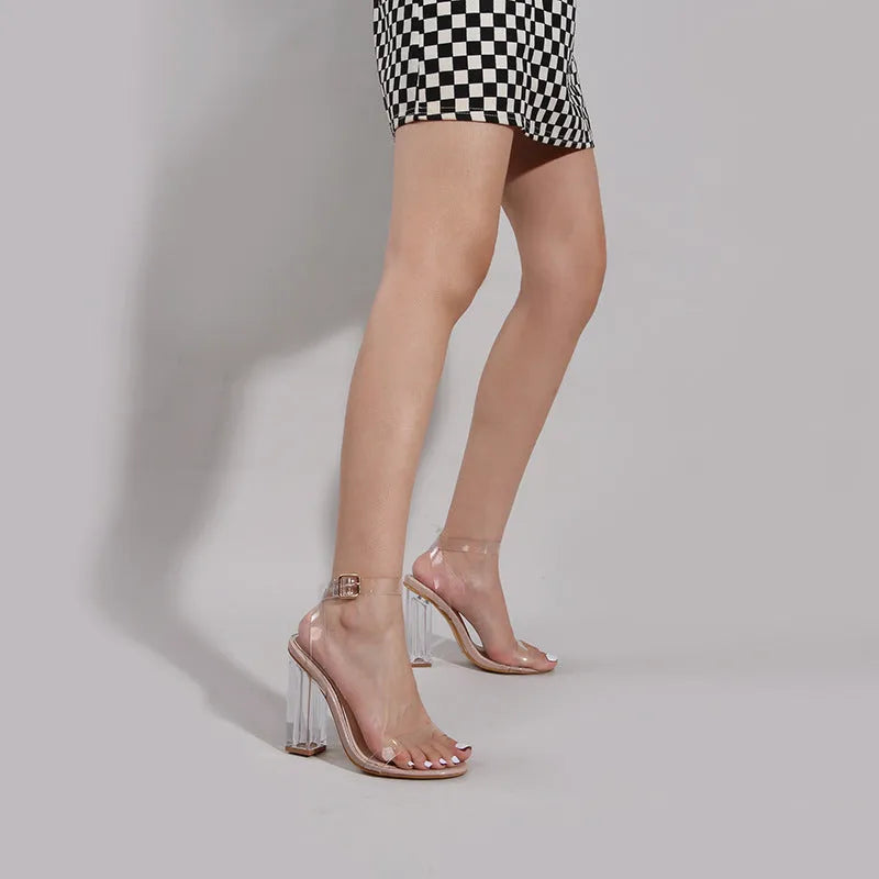 Apricot women's sandals with clear PVC upper, glass heels, and a buckle strap