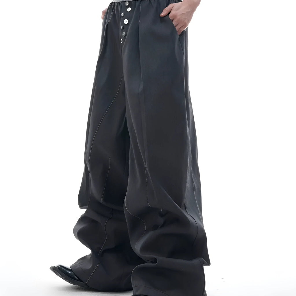 Black straight-leg high-waist trousers with button detail on smart casual model