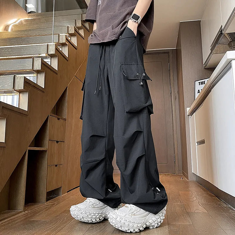 Plus size women's waterproof straight-leg trousers in thin polyester fabric with drawstring waist