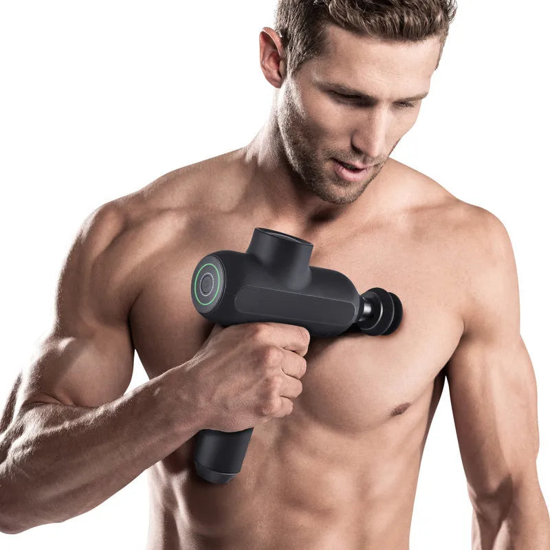 Portable muscle massager with six different massage heads on black background