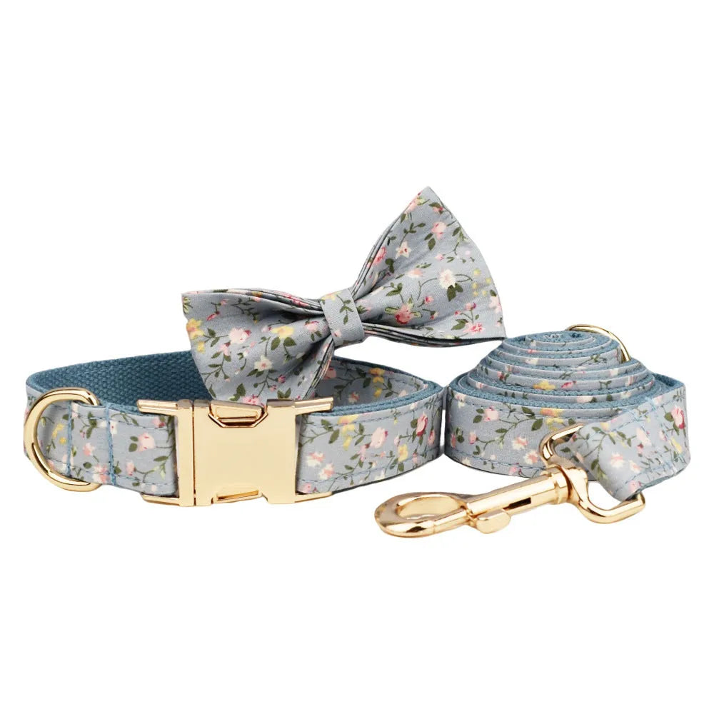 Floral polyester cotton dog collar set with matching leash, vest, bow, and poop bag accessories