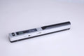 Handheld USB scanner in black, blue, green, red, and silver colour options on a desk.
