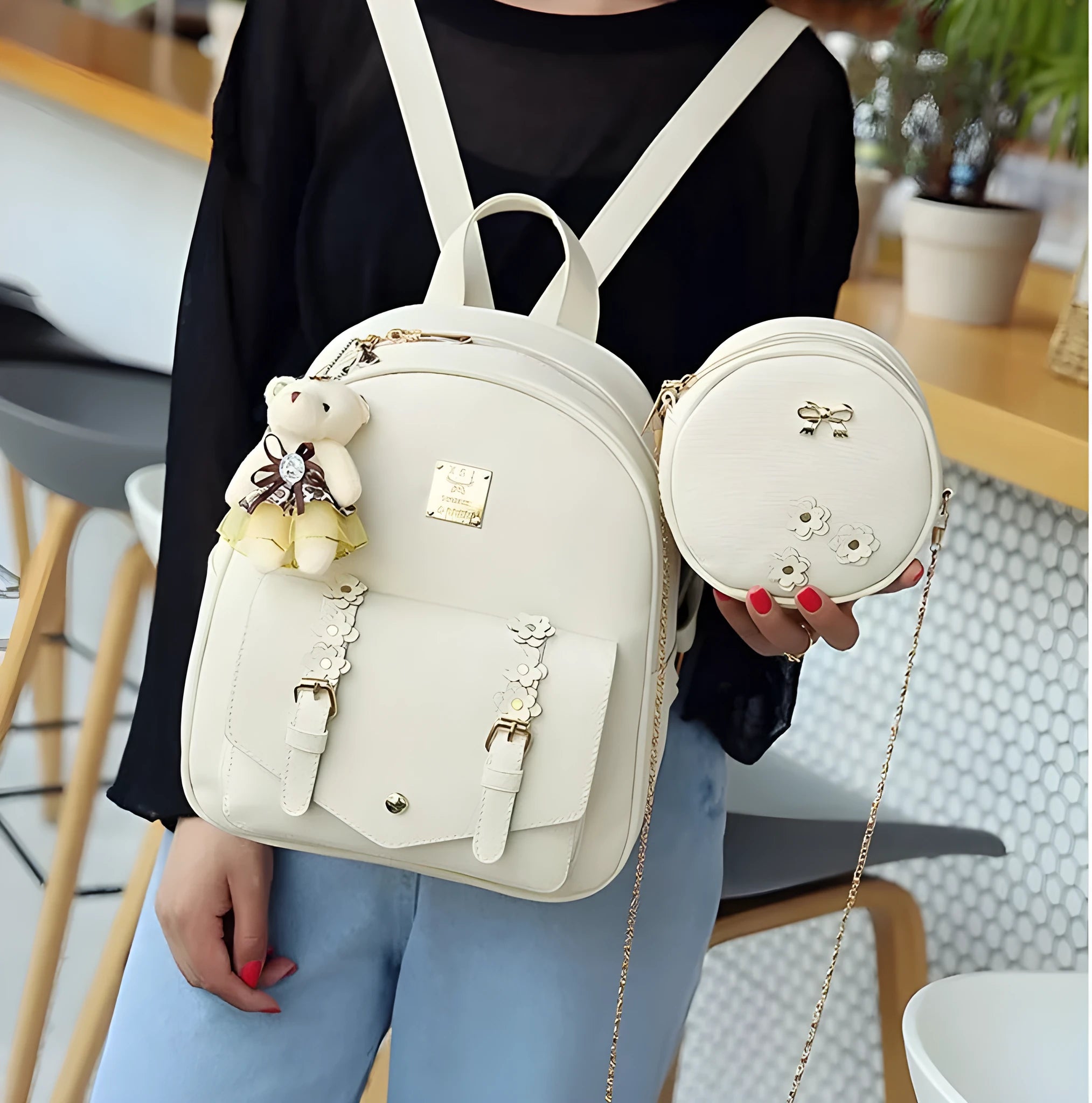 Women's three-piece PU leather bag set showing backpack, shoulder bag, and card holder in matching colour