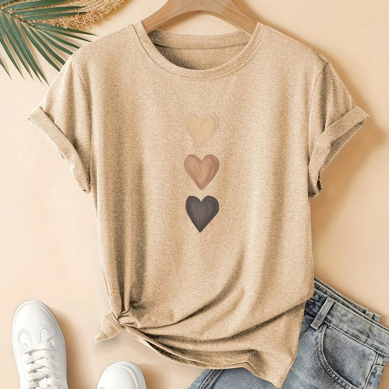 Women's art retro style printed cotton short sleeve T-shirt on a hanger.