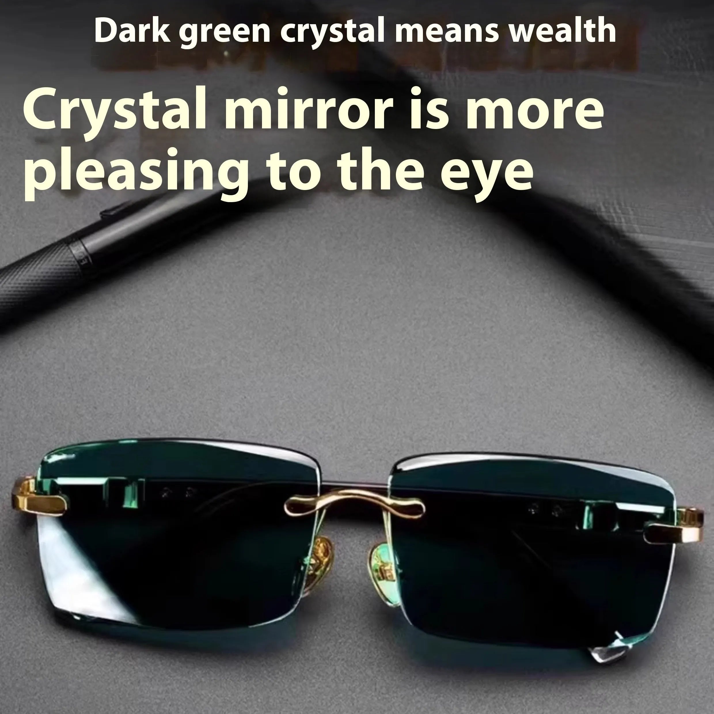 Dark green frameless crystal sunglasses with case and cleaning cloth on a solid background.