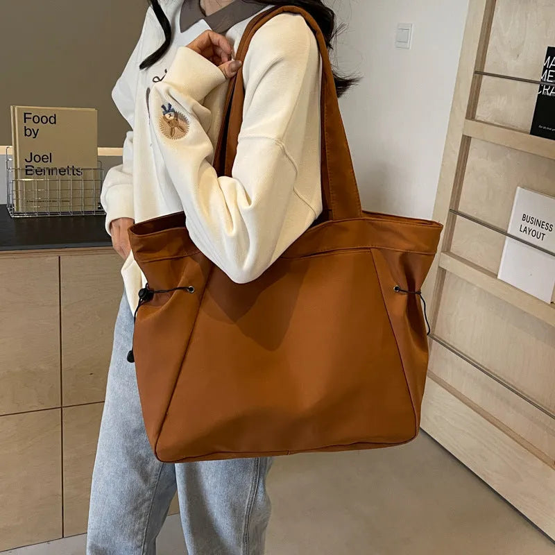 Soft Oxford cloth folding shoulder tote bag shown in available colour options