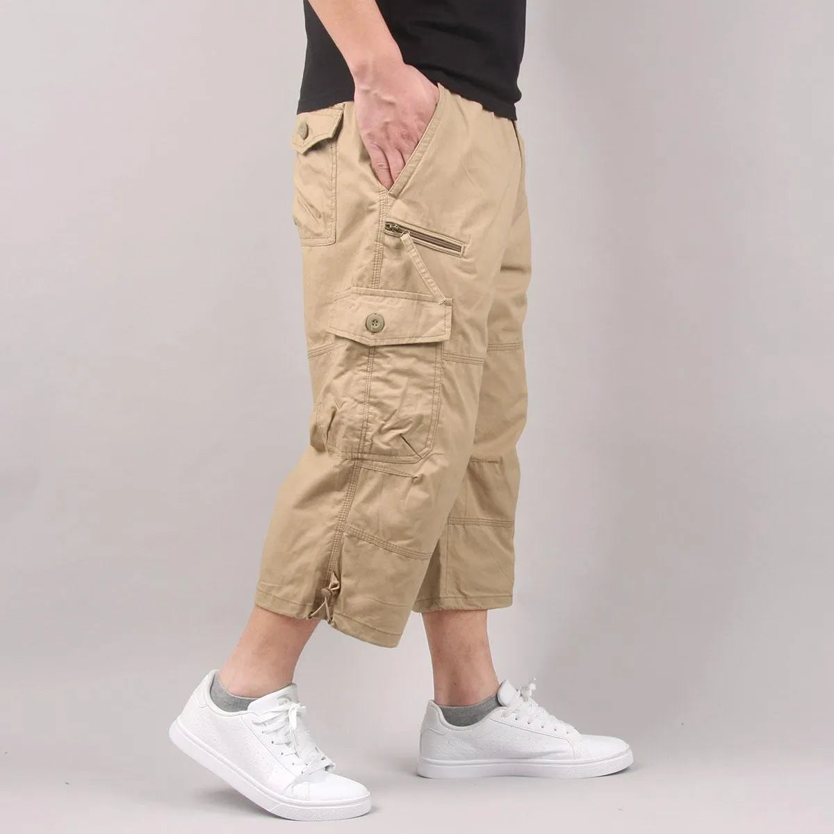 Men's loose-fit cotton cropped casual pants in army green colour on a white background