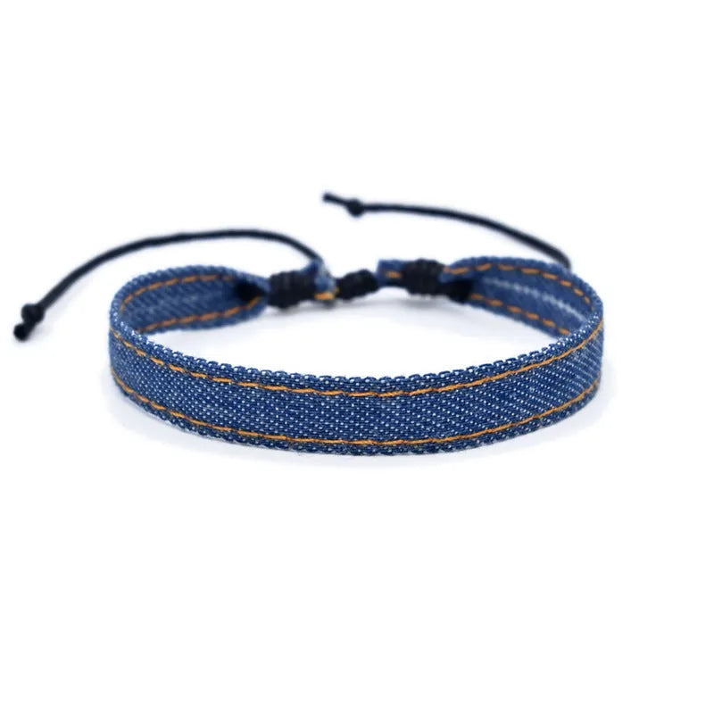 Handmade denim fabric wristband carrying strap in mixed materials with adjustable closure