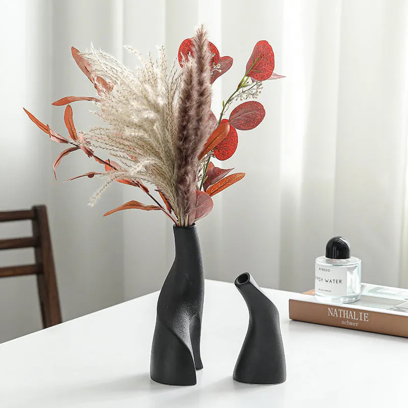 Ceramic shaped double vase in cream colour for Nordic home decoration on shelf