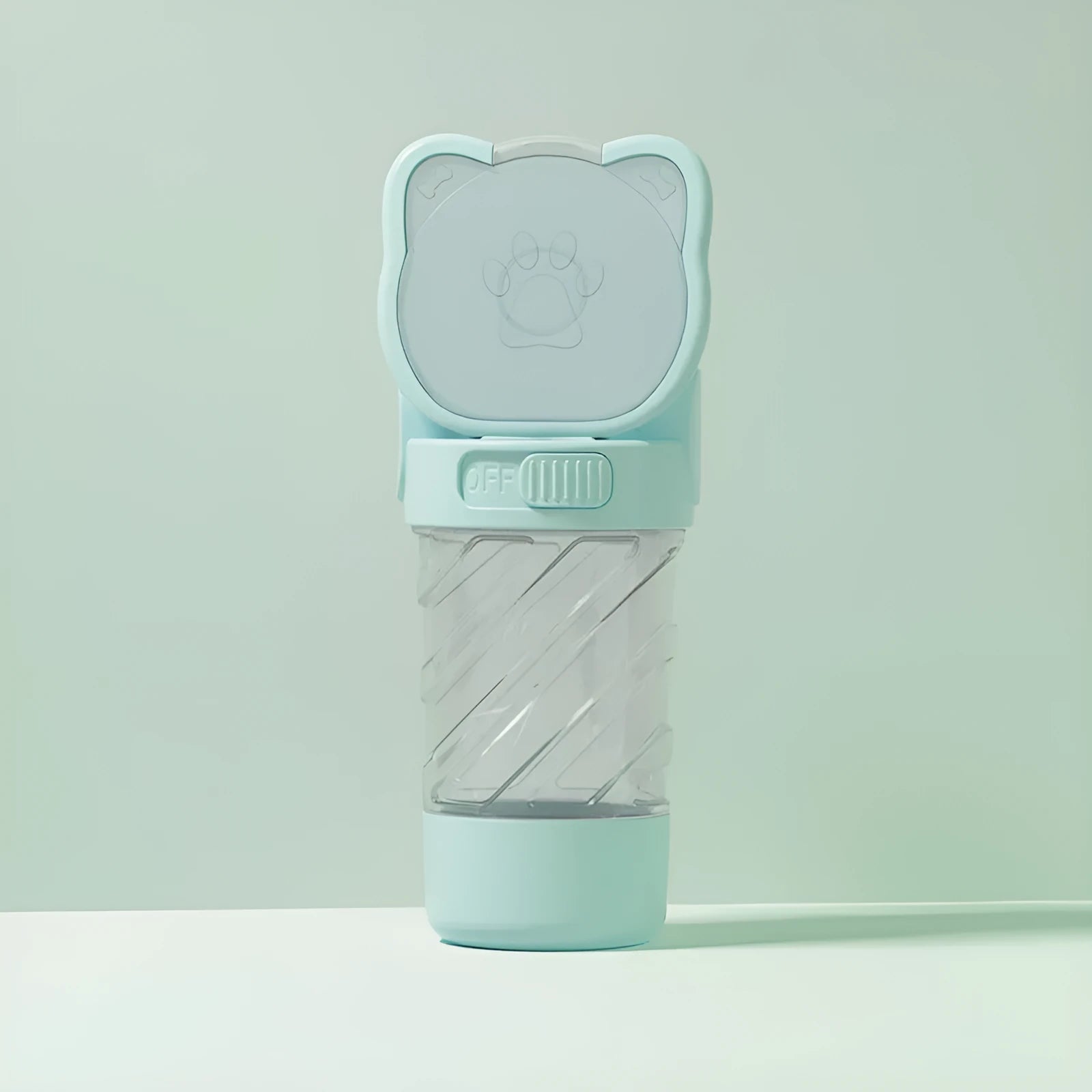 Green 3-in-1 portable pet water bottle with food container and waste bag dispenser attached to a strap.