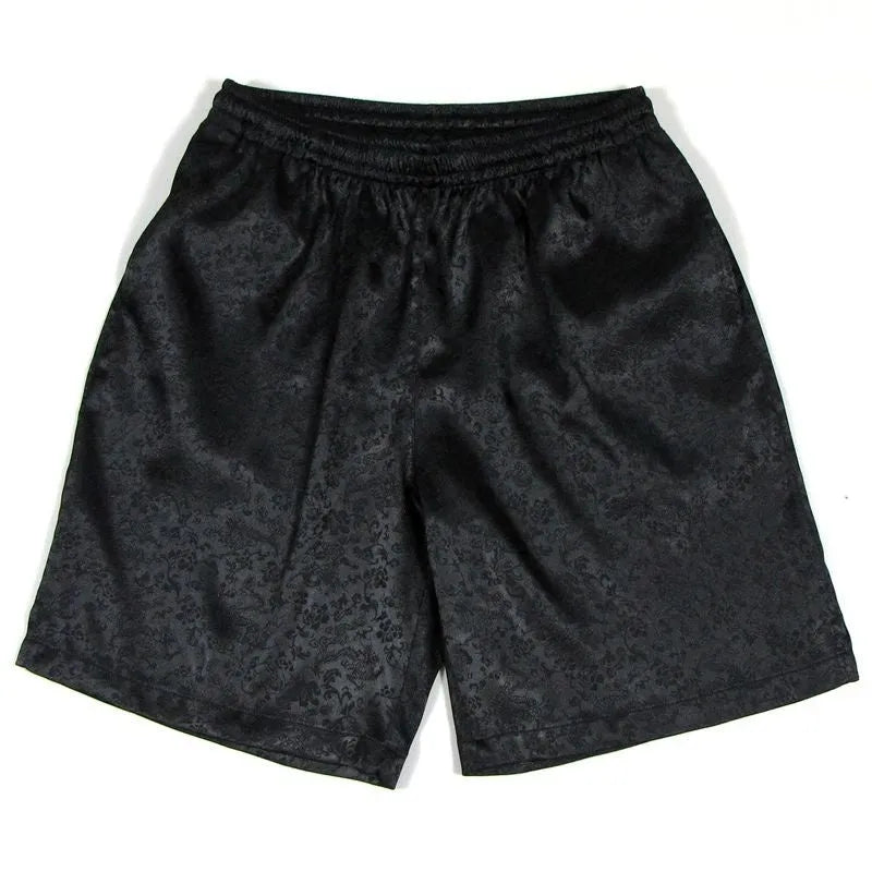 Men's black Tang Suit Tai Chi shorts with a white drawstring elastic waistband laid flat.