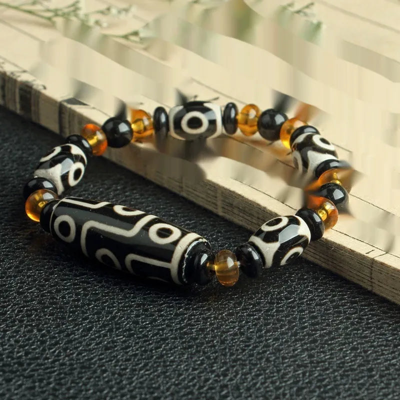 Agate Tibetan dzi bead bracelet with three-eye design and polished finish