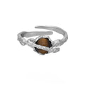 Adjustable opening Saturn ring in white gold colour electroplated silver with tigereye design