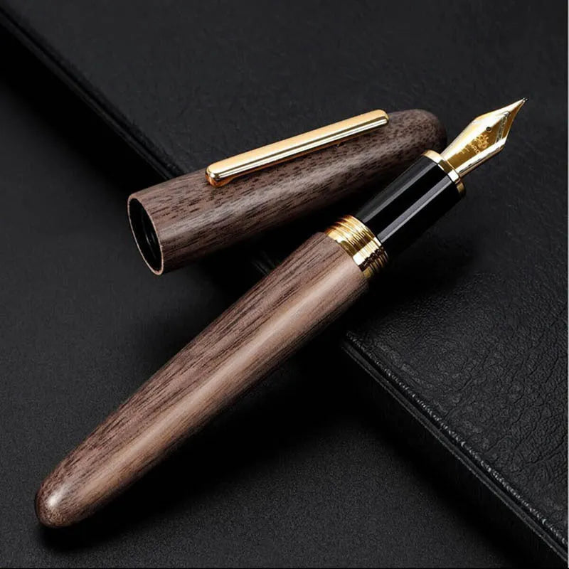 Wooden fountain pen with rotating cap showing natural wood grain