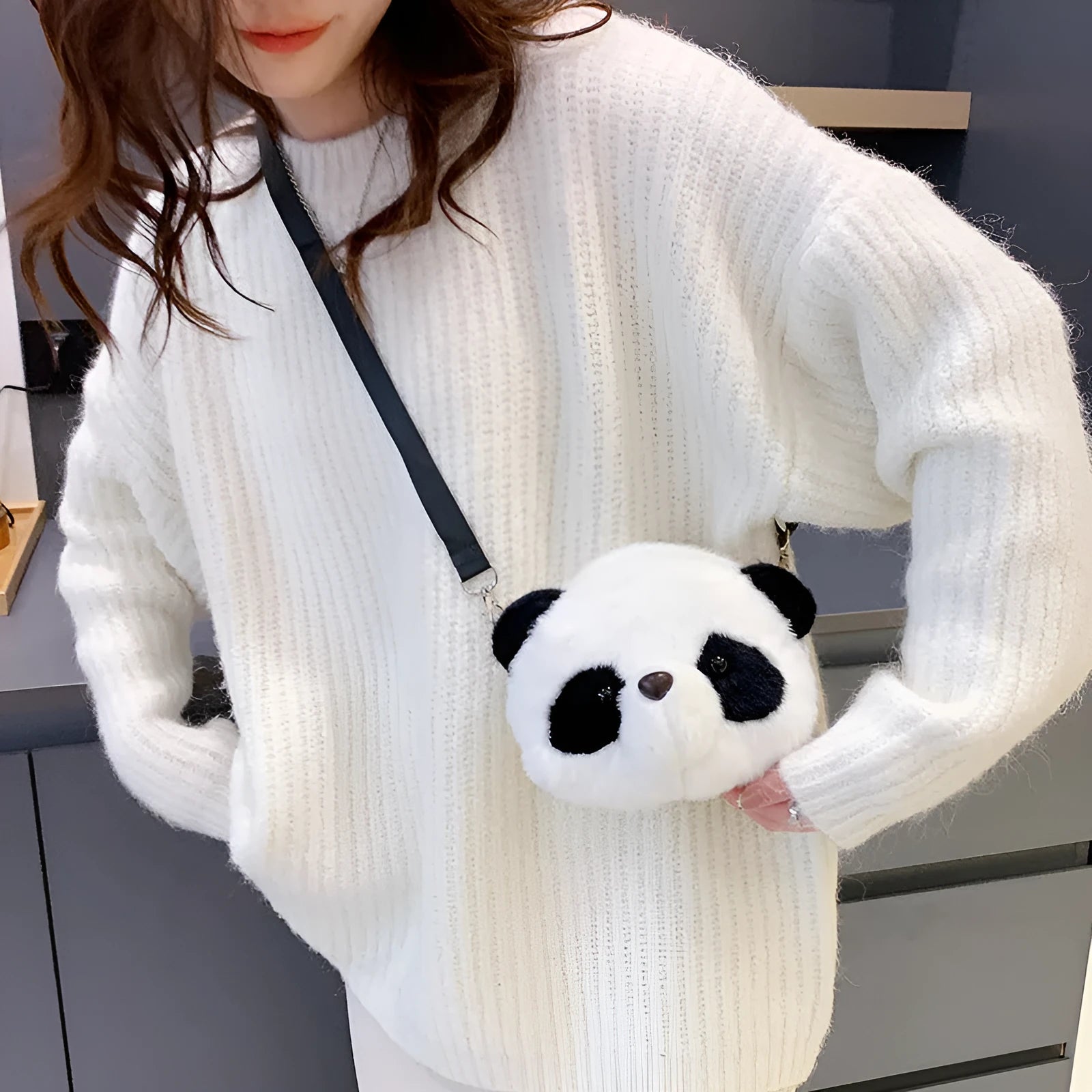 Plush panda head crossbody bag showing cylindrical shape and sandwich pocket organisation