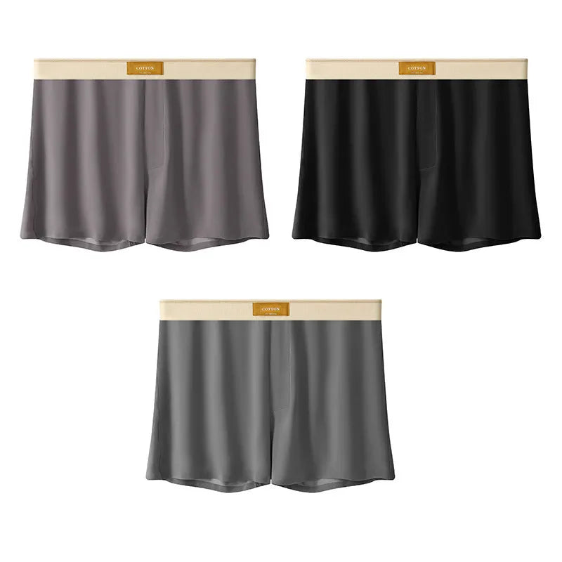 Pack of three pairs of men's solid colour ice silk underwear on a white background.