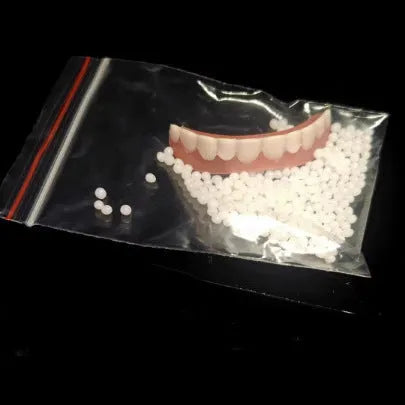 Silicone simulation dentures set showing upper and lower artificial teeth for dental training