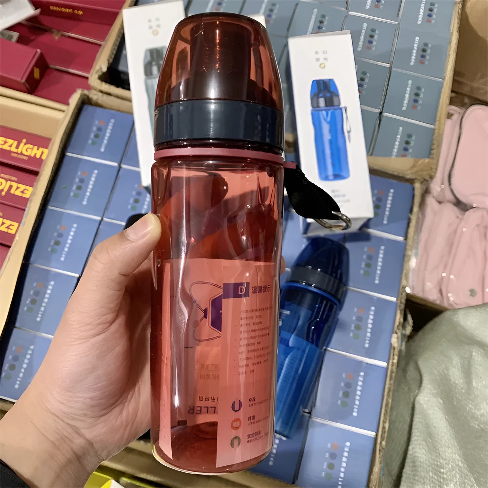 Chinese-style portable water cup with tea compartment in blue, red, black, or grey colour.