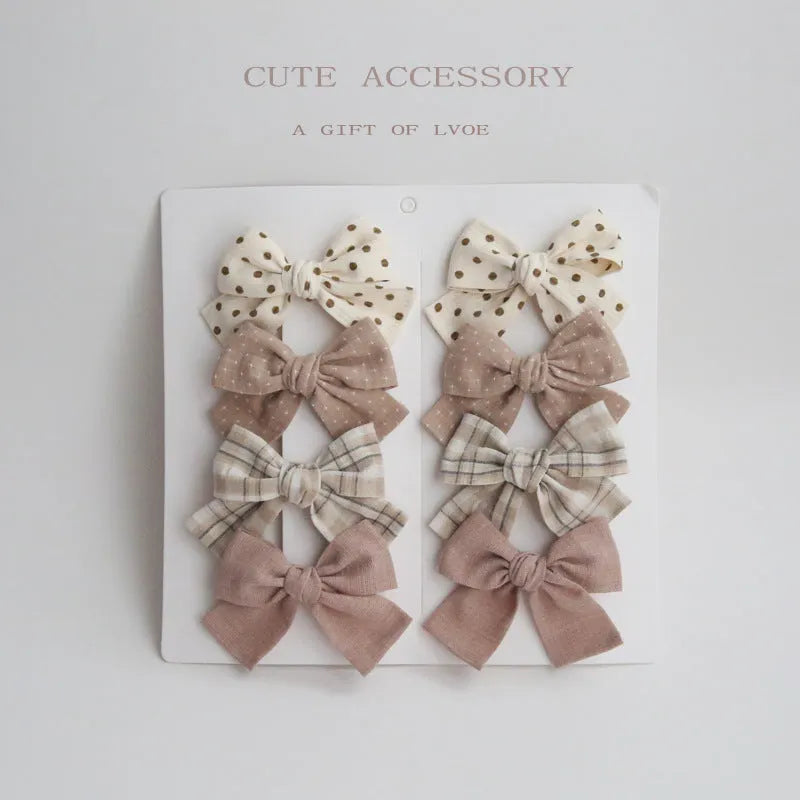 Children's eight-piece cloth bow hairclip set in dovetail shape with multiple colour options