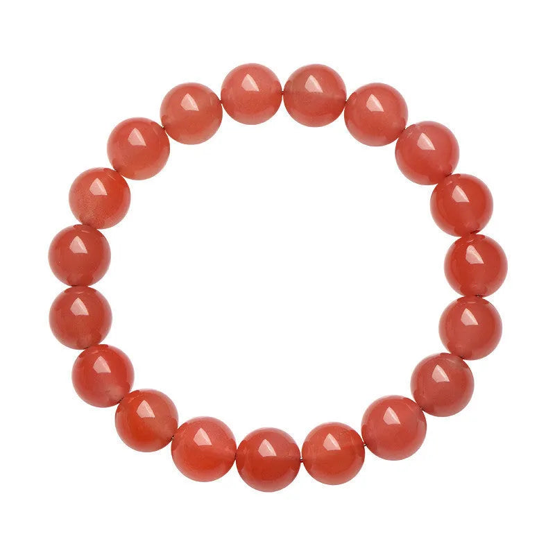 Natural cherry red agate bracelet with polished beads on a white background.