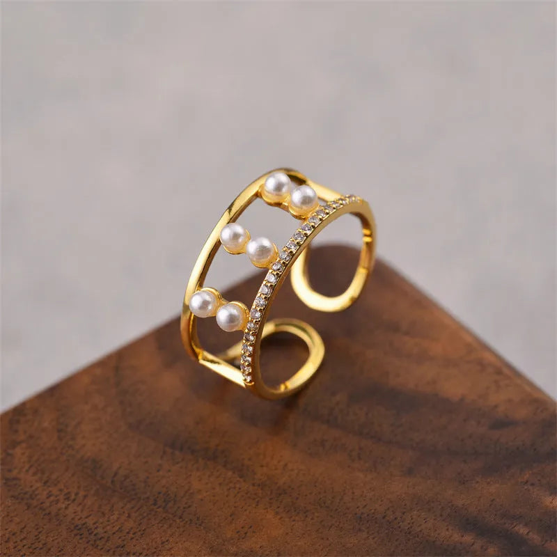 Korean women's adjustable open geometric ring with gold electroplated finish on copper