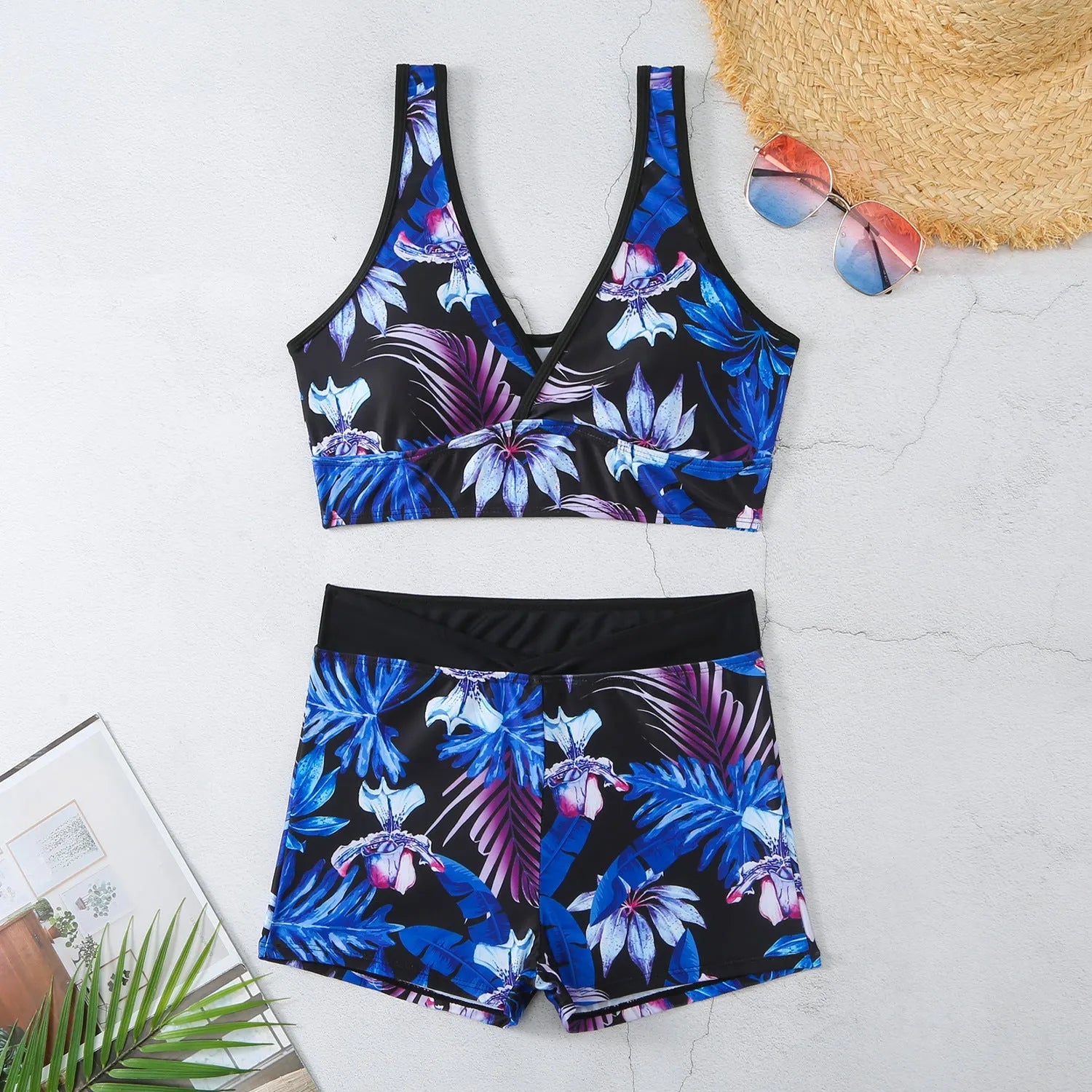 Women's two-piece printed swimsuit with high-neck top and boxer shorts in a multi-colour design.